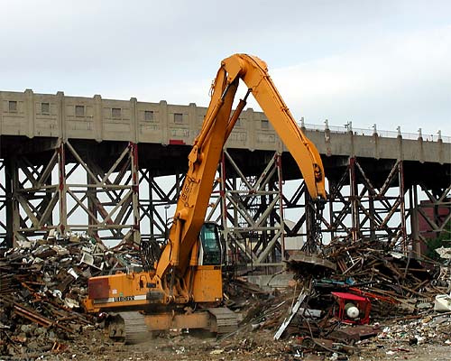 Photograph of a crane lifting scrap metal